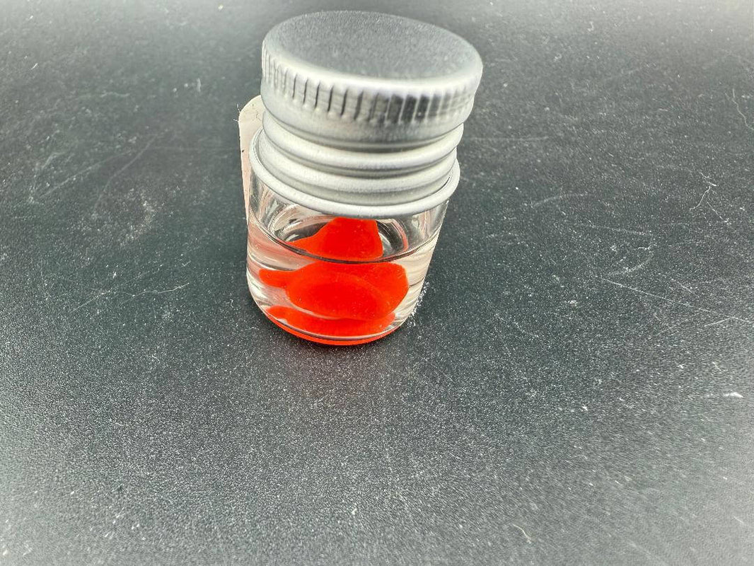 Lucky Gnome Glass Terp Pearl - Boxing glove in a small jar with a grey lid.