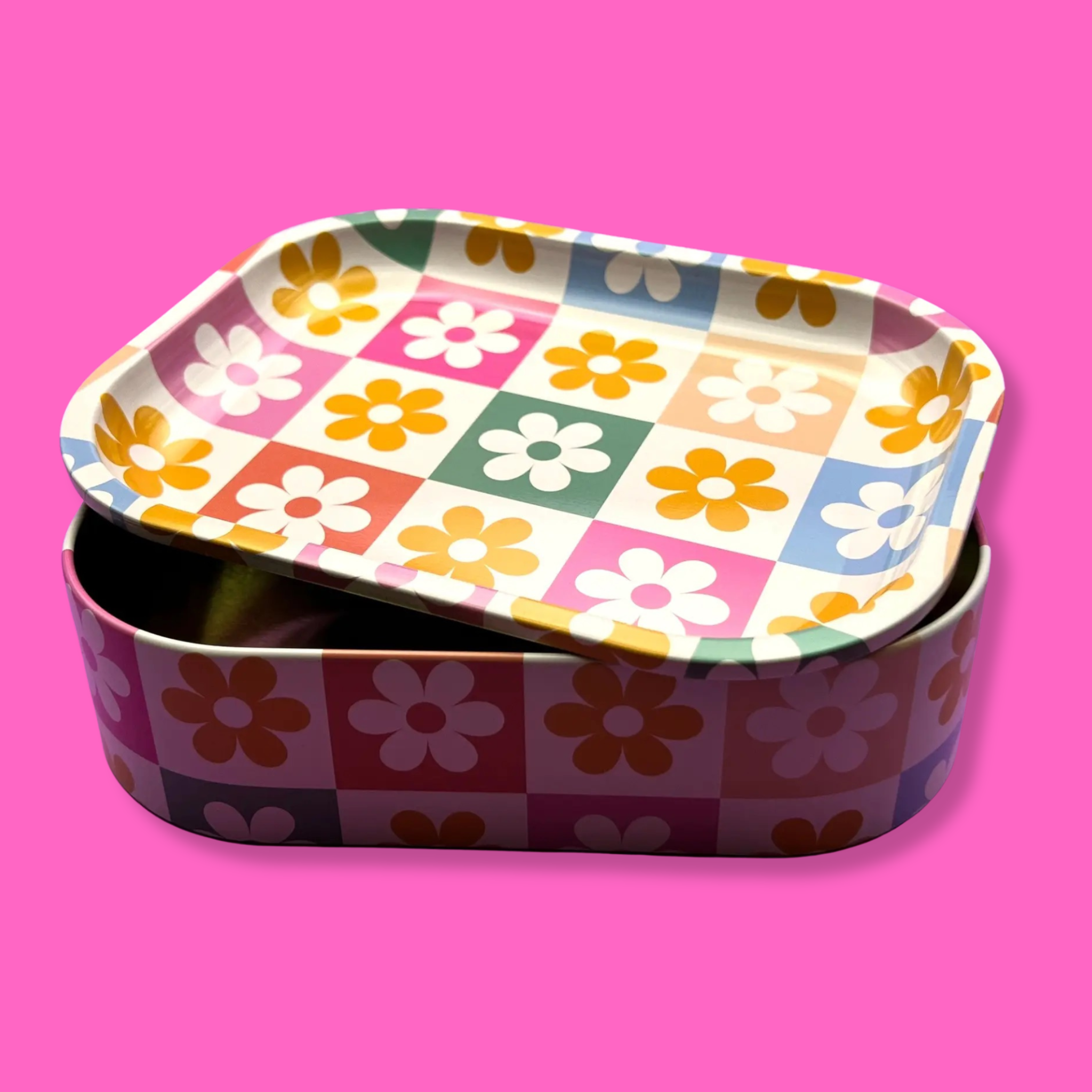 Coming Soon: Retro Flower Metal Storage Box with Tray Lid on a pink background, showcasing the colorful flower pattern.