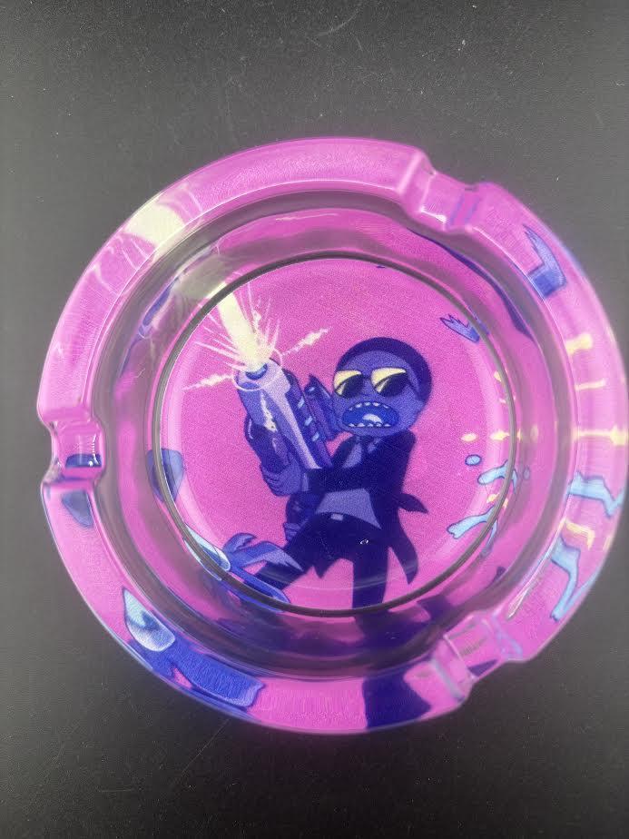 Rick and Morty Glass Ash Tray featuring vibrant artwork of a character with a gun on a colorful background.