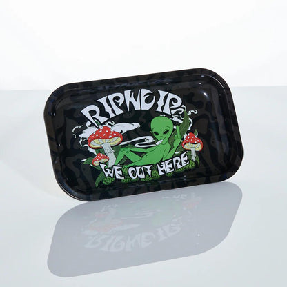 RipNDip We Out Here Rolling Tray featuring alien and mushrooms graphic on a sleek metal surface.