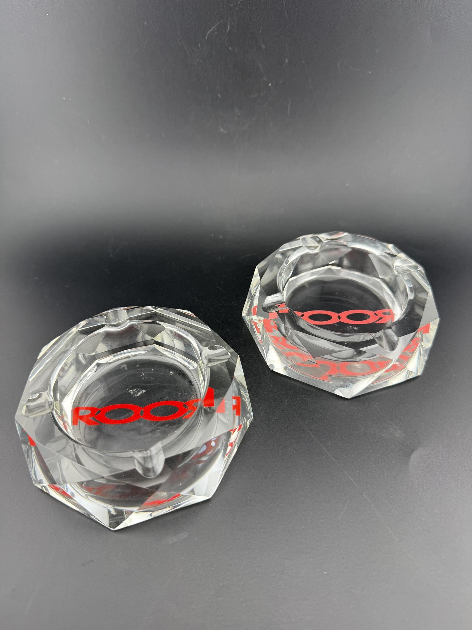 ROOR Ashtray - Crystal Cut, two elegant crystal glass ashtrays featuring the ROOR logo, ideal for smoking spaces.