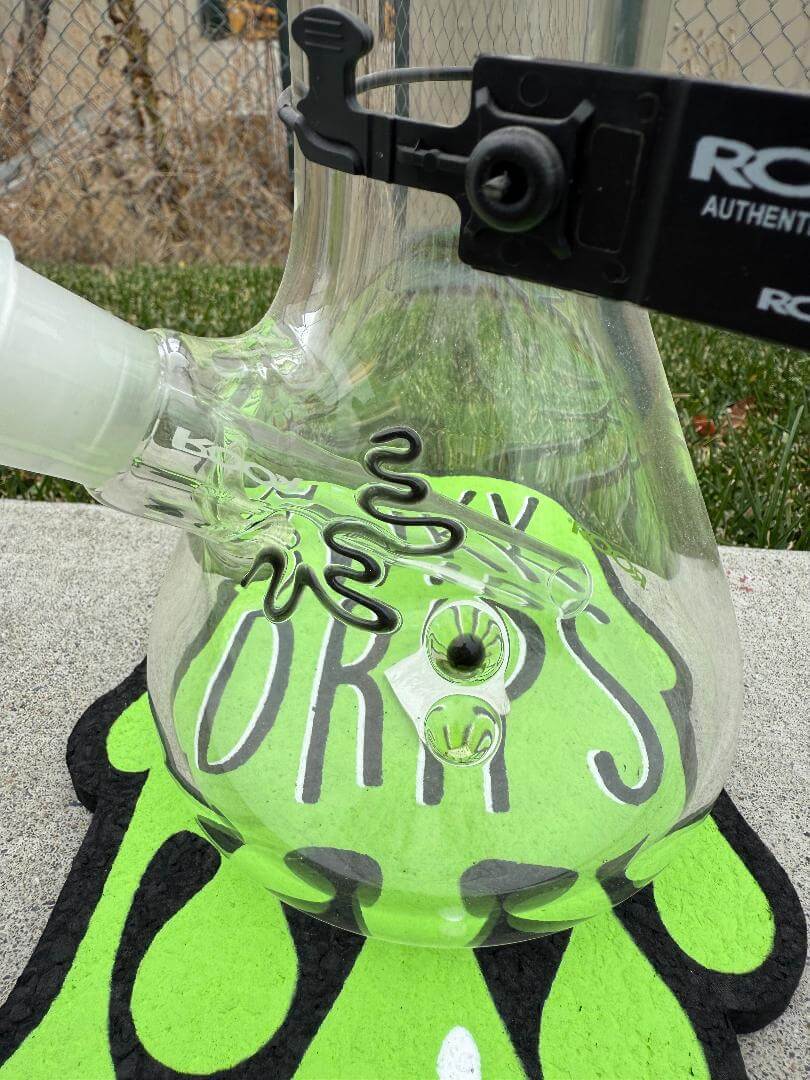 ROOR Glass 14" Beaker 50 x 7mm Thick 14mm 45° - Green showcasing its inside design and features on a green background.