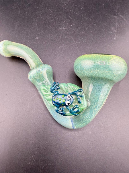 Rosie Works Sherlock Pipe - Green Frit w/ Leaf & Blue Frog Attachment on a black background