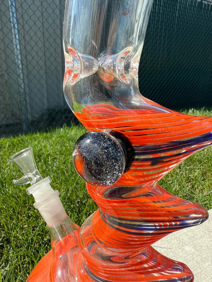 Round Glass Orange And Blue Spiked Bubble beaker 14mm 45° showcasing vibrant colors and unique texture.