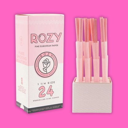 Rozy Pink Cones 24pk featuring pre-rolled pink cones in a stylish box against a vibrant pink background.