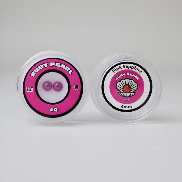 Ruby Pearl Co Terp Pearls – Ruby & Sapphire 4mm AAA Lab-Grown Gemstones (2-Pack) in stylish packaging.