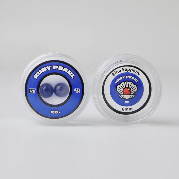 Ruby Pearl Co Terp Pearls – Ruby & Sapphire 6mm AAA Lab-Grown Gemstones (2-Pack) packaging with Blue Sapphire and Ruby Pearl branding.