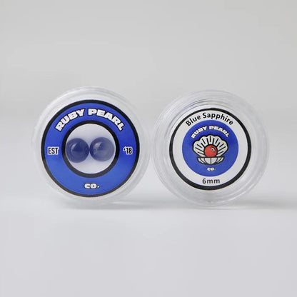 Ruby Pearl Co Terp Pearls – Ruby & Sapphire 6mm AAA Lab-Grown Gemstones (2-Pack) packaging with Blue Sapphire and Ruby Pearl branding.