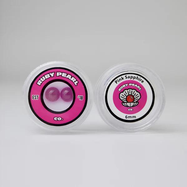 Ruby Pearl Co Terp Pearls – Ruby & Sapphire 6mm AAA Lab-Grown Gemstones (2-Pack) in packaging.
