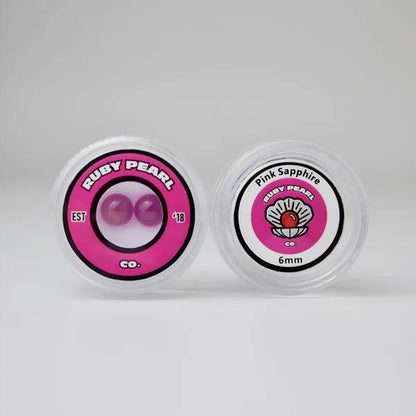 Ruby Pearl Co Terp Pearls – Ruby & Sapphire 6mm AAA Lab-Grown Gemstones (2-Pack) in packaging.