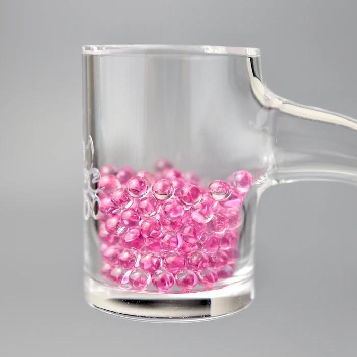 Ruby Pearl Co Terp Pearls – Ruby & Sapphire 3mm AAA Lab-Grown Gemstones (10-Pack) in a clear glass container.