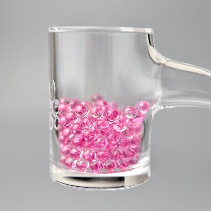 Ruby Pearl Co Terp Pearls – Ruby & Sapphire 3mm AAA Lab-Grown Gemstones (10-Pack) in a clear glass container.