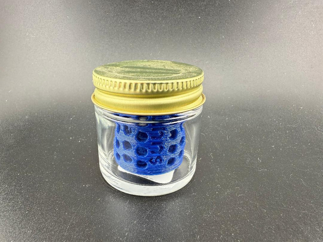 Ruby Pearl Co Pearl Jar Washing Station in a clear jar with a gold lid, showcasing its effective design for cleaning.