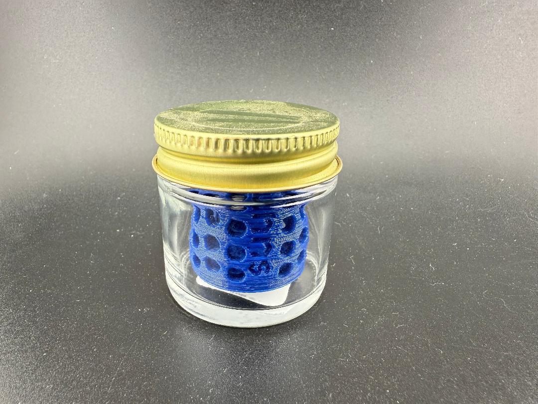 Ruby Pearl Co Pearl Jar Washing Station in a clear jar with a gold lid, showcasing its effective design for cleaning.