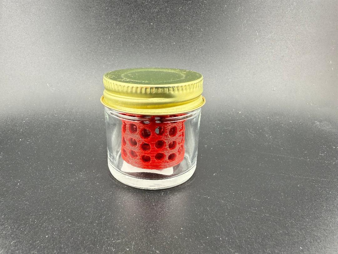 Ruby Pearl Co Pearl Jar Washing Station in a glass jar with a gold lid, designed for cleaning pearls.