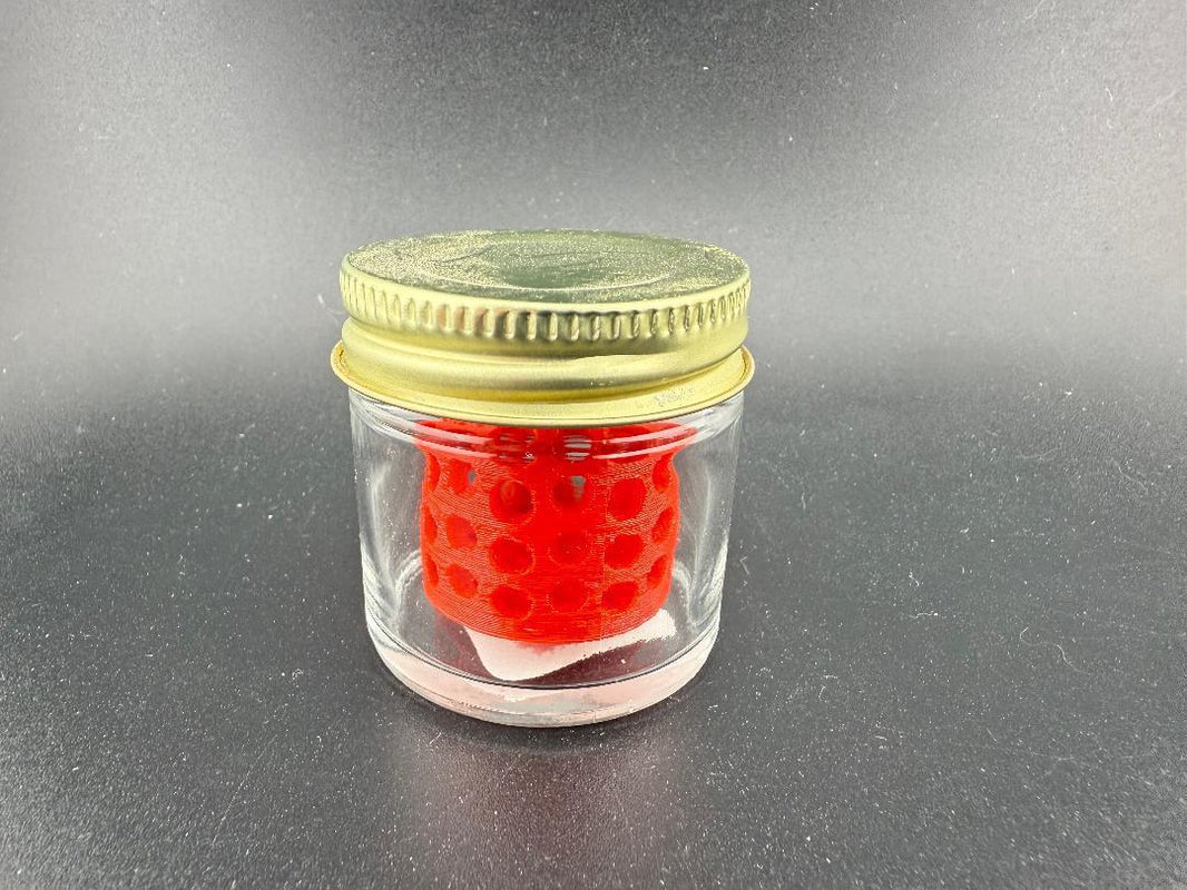 Ruby Pearl Co Pearl Jar Washing Station showcasing a red pearl inside a clear glass jar.