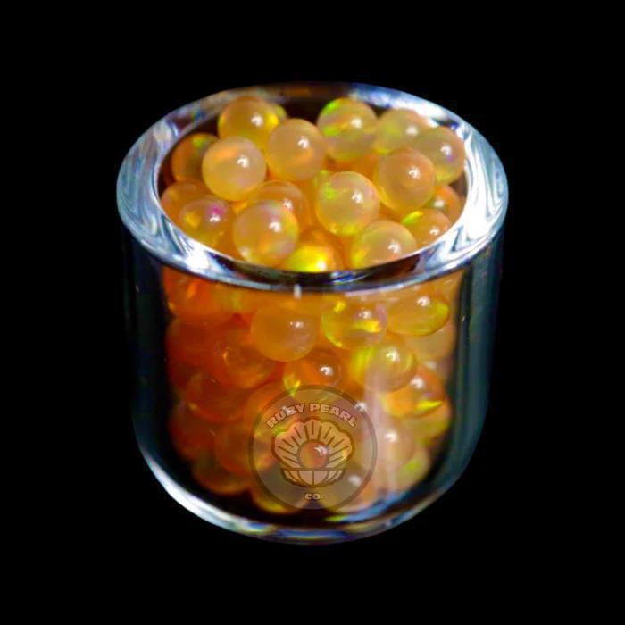 Ruby Pearl Co Terp Pearls – Opal 3mm in a glass container, showcasing vibrant synthetic opal colors.