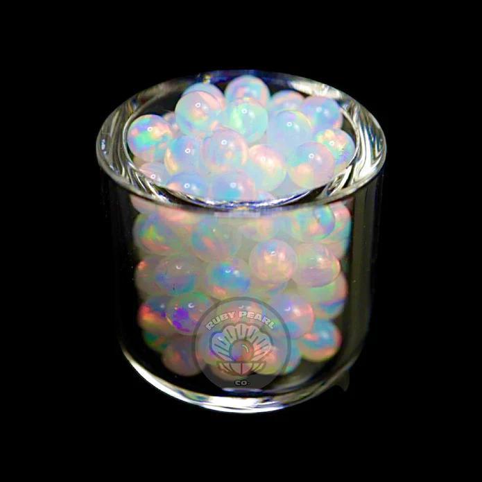 Ruby Pearl Co Terp Pearls – Opal 3mm in a glass container showcasing vibrant synthetic opal design.