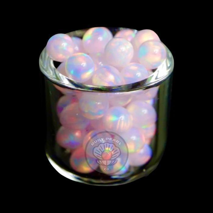 Ruby Pearl Co Terp Pearls – Opal 4mm in a glass jar, showcasing vibrant synthetic opal colors.
