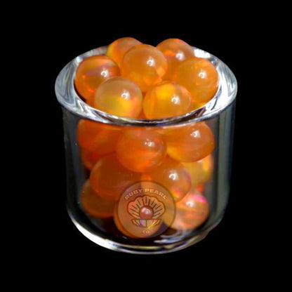 Ruby Pearl Co Terp Pearls - Opal 5mm in a glass container with vibrant orange color.