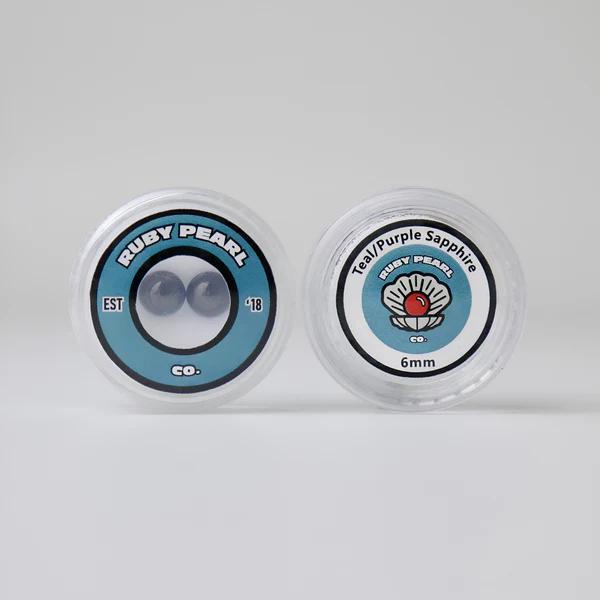 Ruby Pearl Co Terp Pearls – Ruby & Sapphire 6mm AAA Lab-Grown Gemstones (2-Pack) packaging display.