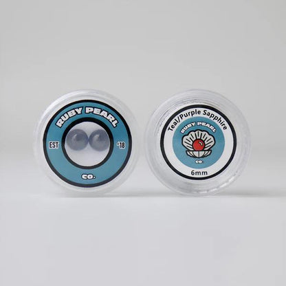 Ruby Pearl Co Terp Pearls – Ruby & Sapphire 6mm AAA Lab-Grown Gemstones (2-Pack) packaging display.