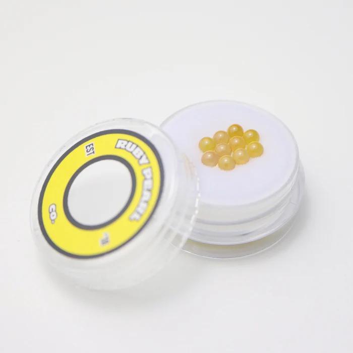 Ruby Pearl Co Terp Pearls – Ruby & Sapphire 3mm AAA Lab-Grown Gemstones (10-Pack) in a container.