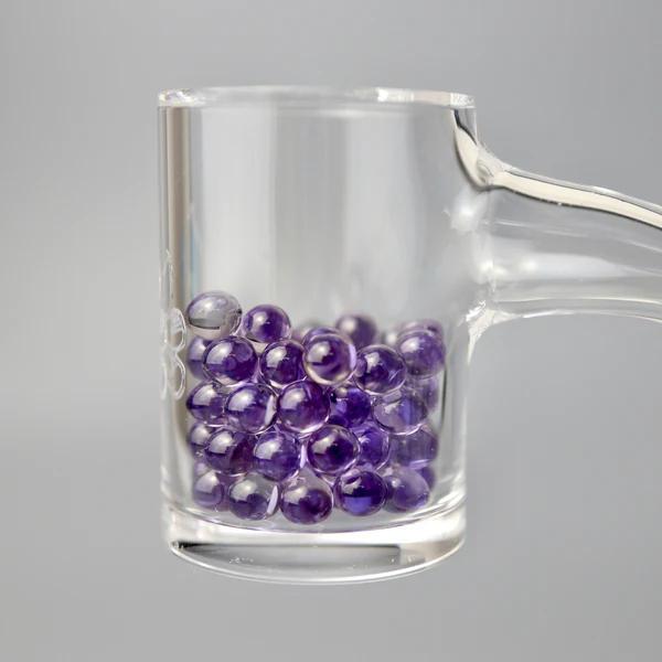 Ruby Pearl Co Terp Pearls – Ruby & Sapphire 4mm AAA Lab-Grown Gemstones (2-Pack) in glass container.