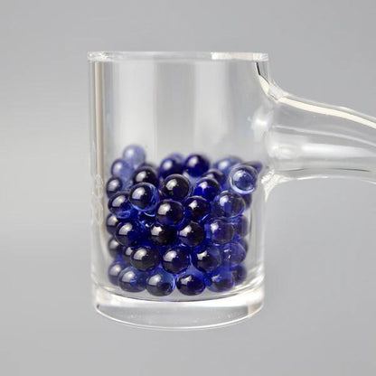 Ruby Pearl Co Terp Pearls – Ruby & Sapphire 4mm AAA Lab-Grown Gemstones (2-Pack) in glass holder.