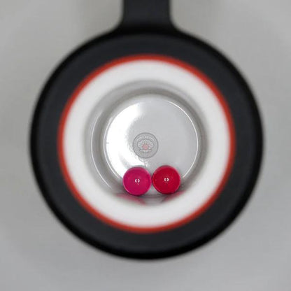 Ruby Pearl Co Terp Pearls – Ruby & Sapphire 4mm AAA Lab-Grown Gemstones (2-Pack) displayed in a black rig.