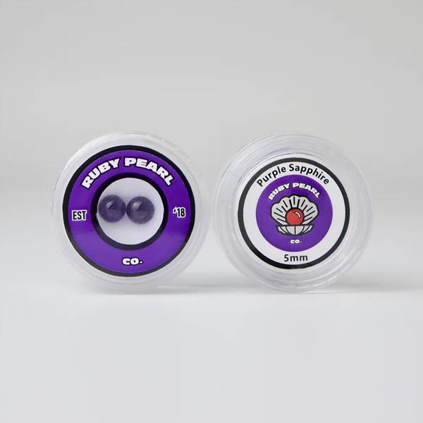 Ruby Pearl Co Terp Pearls - Ruby & Sapphire 5mm Pack of two lab-grown gemstones in clear containers.