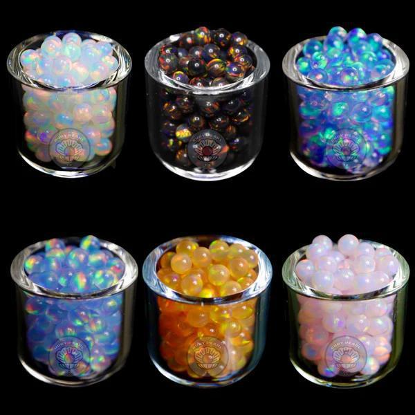 Ruby Pearl Co Terp Pearls – Opal 3mm in glass containers featuring various colors and designs.