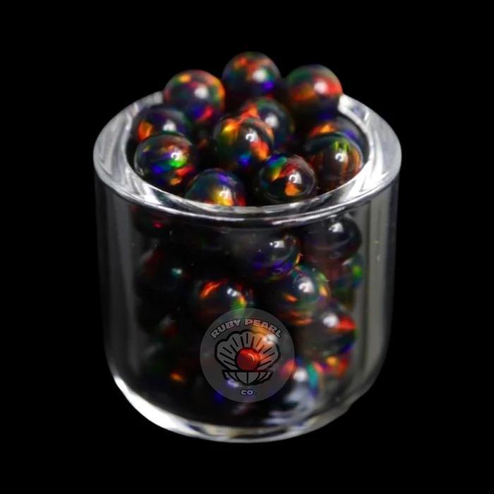 Ruby Pearl Co Terp Pearls – Opal 4mm in a jar, showcasing vibrant colors and smooth performance for dabbing.