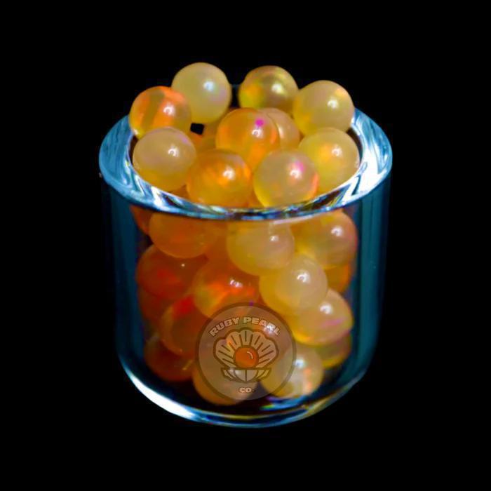 Ruby Pearl Co Terp Pearls – Opal 4mm in a glass container showcasing vibrant colors and smooth performance.