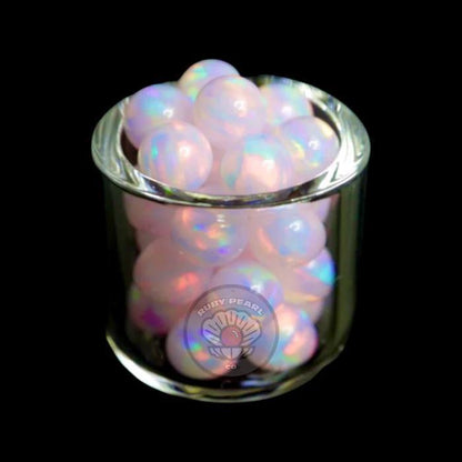 Ruby Pearl Co Terp Pearls - Opal 5mm in a glass container showcasing their vibrant colors and design.