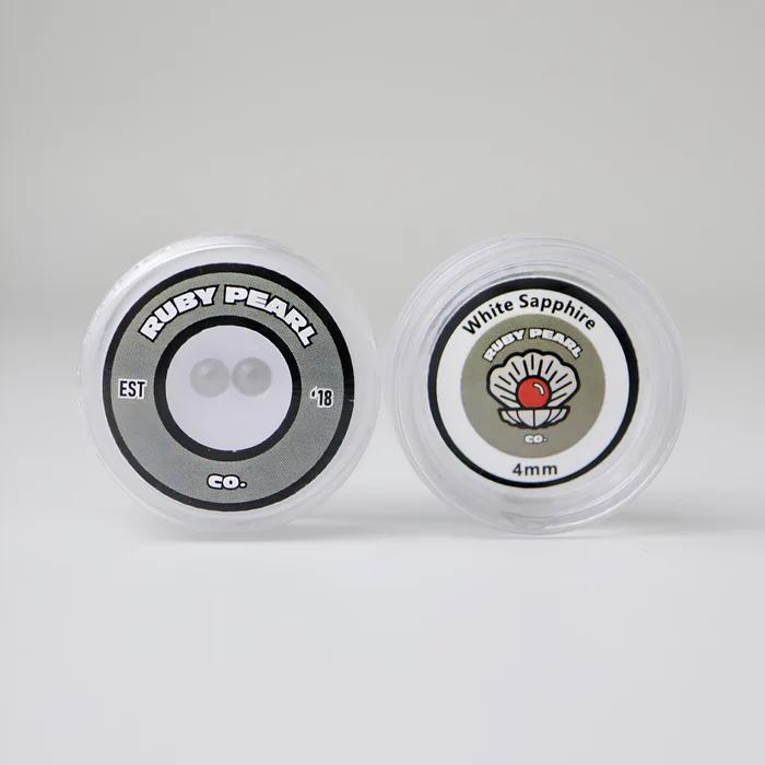 Ruby Pearl Co Terp Pearls – Ruby & Sapphire 4mm AAA Lab-Grown Gemstones (2-Pack) packaging display.
