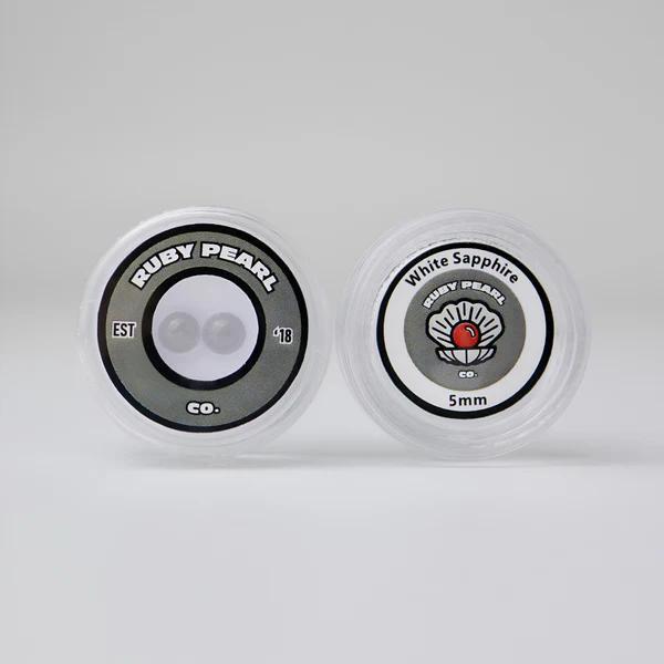 Ruby Pearl Co Terp Pearls - Ruby & Sapphire 5mm in packaging, showcasing premium lab-grown gemstones.