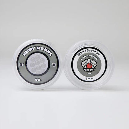 Ruby Pearl Co Terp Pearls – Ruby & Sapphire 3mm AAA Lab-Grown Gemstones (10-Pack) in clear packaging.