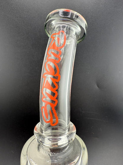 Ruckus 9" Bent Neck Drippy Pendant Rig 14mm 90° showcasing its unique bent neck and branding details.