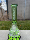 Ruckus Glass 14" Thick Bottom Beaker 14mm 90° in green on grass