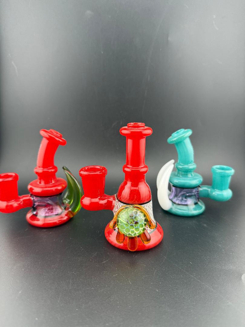 Ruckus Glass 4" Double Horn Micro Rig 14mm 90° in Red and Teal with bold design and unique shapes.
