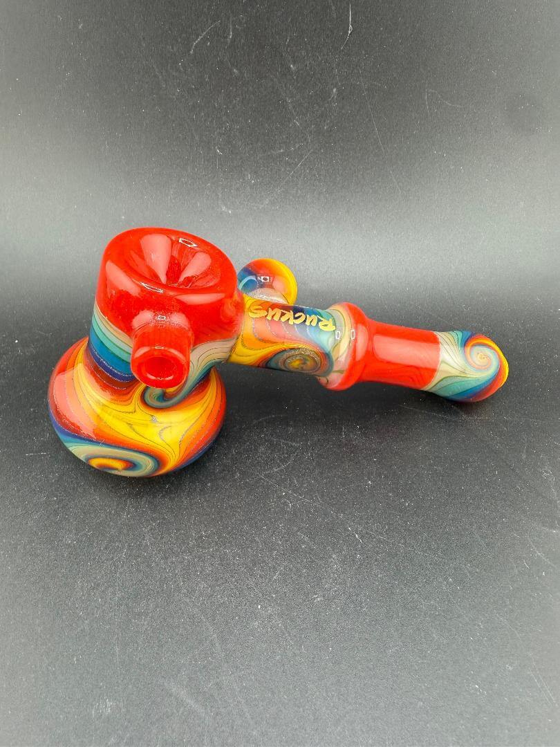 Ruckus Glass Bubbler - 5" Wig Wag in vibrant colors featuring swirling patterns and ergonomic design.