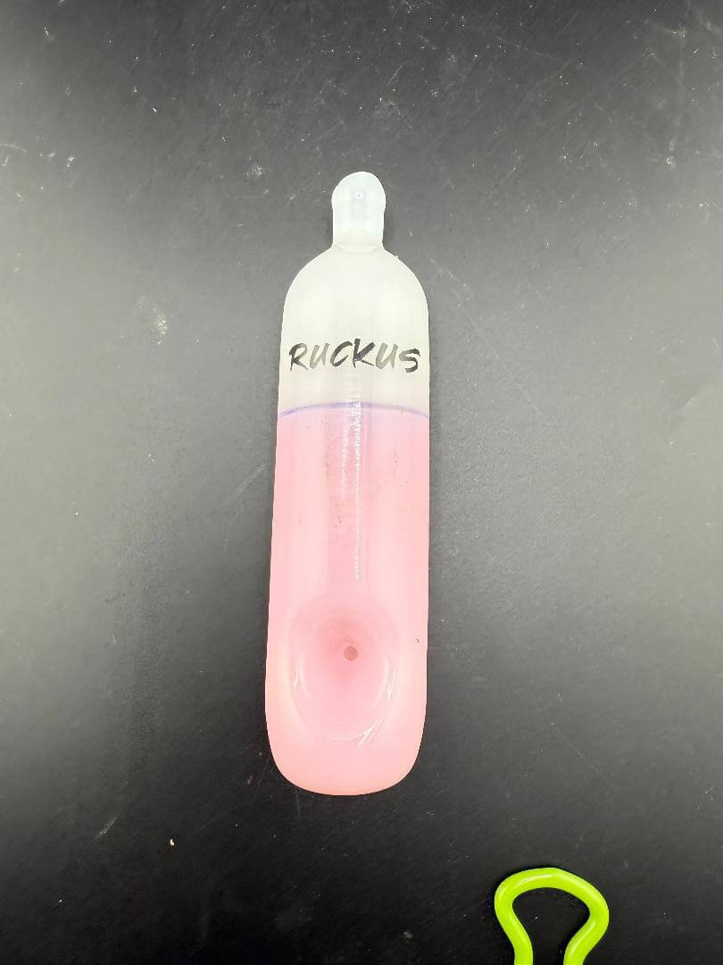 Ruckus Glass Pipe - 5" Disposable Vape shown in pink glass with Ruckus branding.