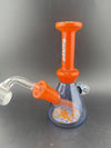 Ruckus Glass Two Tone Wig Wag Tube 14mm 45° in vibrant orange color, showcasing its unique design and craftsmanship.