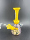 Ruckus Glass Two Tone Wig Wag Tube 14mm 45° in yellow, featuring vibrant colors and artistic design.