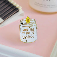 Occasionalish Enamel Pin - Shine Bright featuring a candle design with 'You Are Meant to Shine' text.
