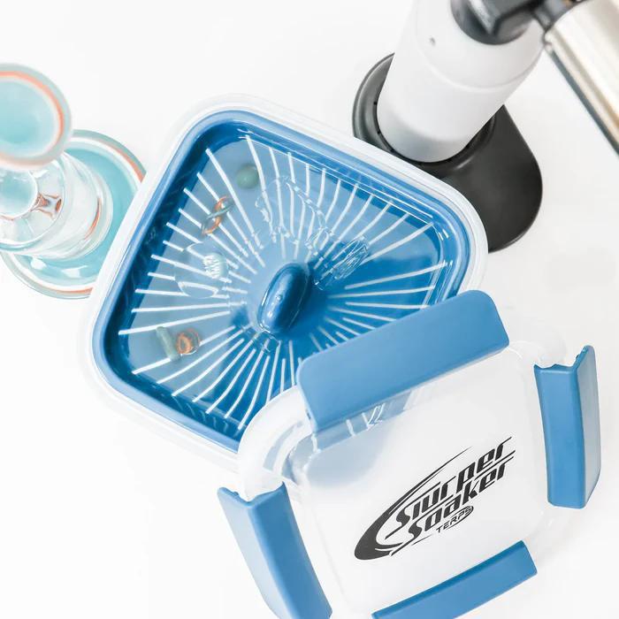 Slurper Soaker Terp Slurper Banger Cleaning Basket shown with blue lid and cleaning station.