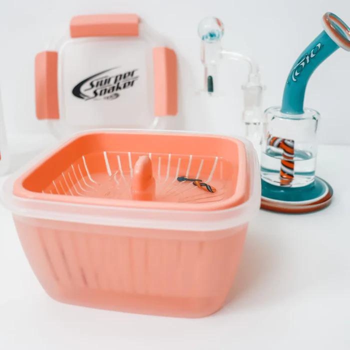 Slurper Soaker Terp Slurper Banger Cleaning Basket in pink, designed for easy cleaning of quartz bangers and glass accessories.