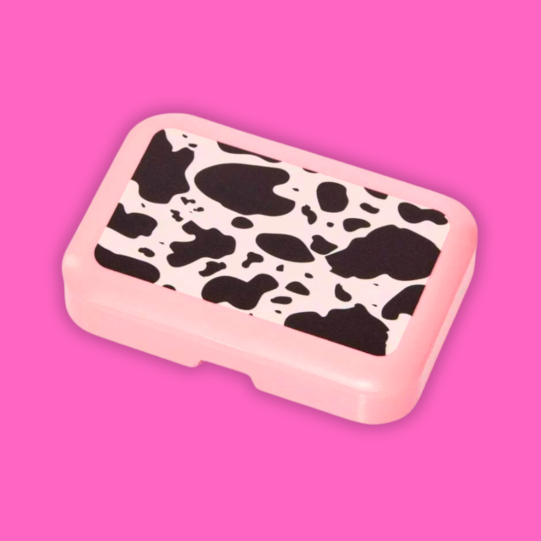 A Shop Of Things Mini Stash Box - Moo in cow print design on a pink background.