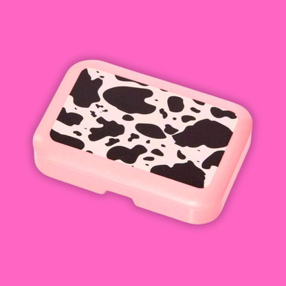 A Shop Of Things Mini Stash Box - Moo in cow print design on a pink background.